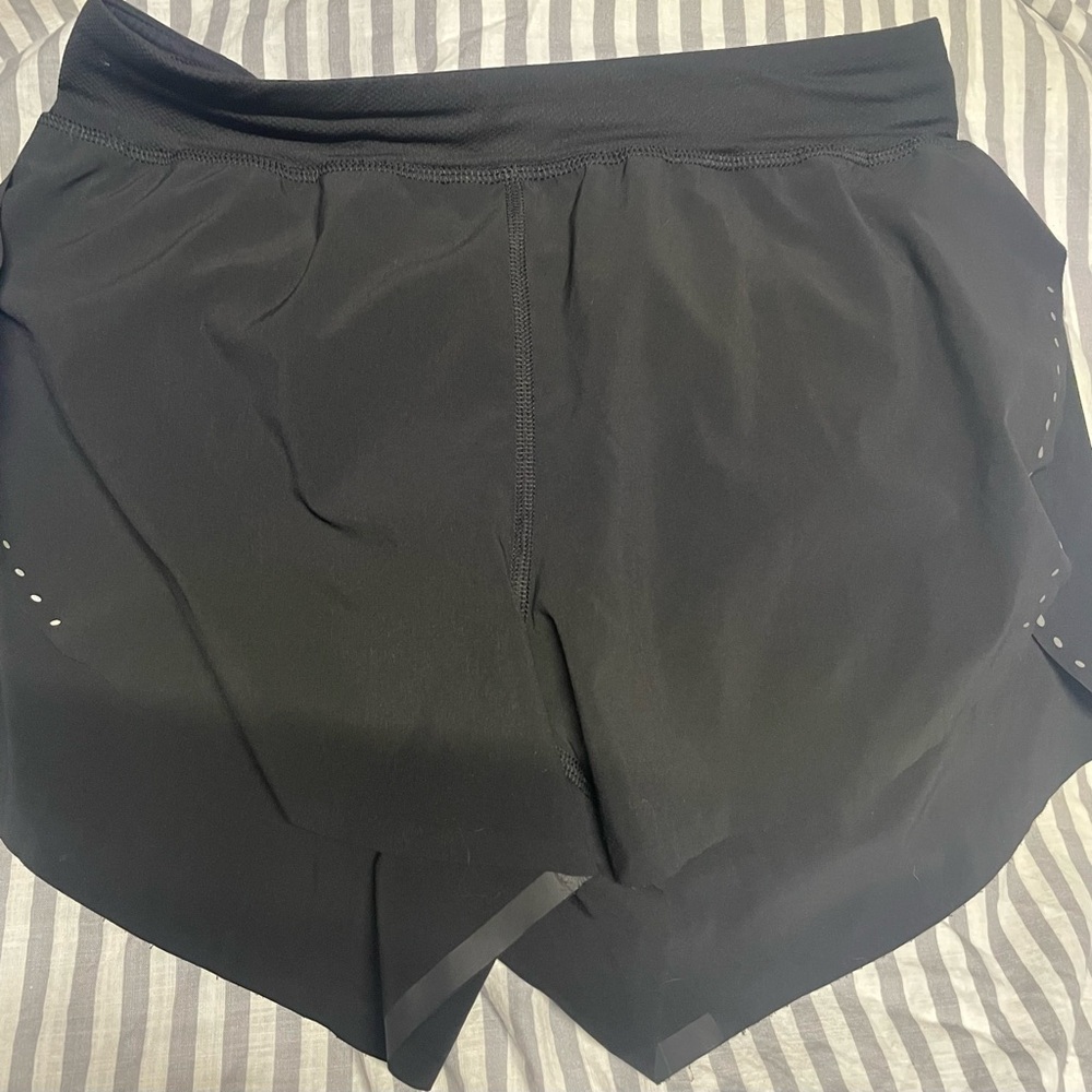 Women’s, black Lulumelon shirts. Size 6